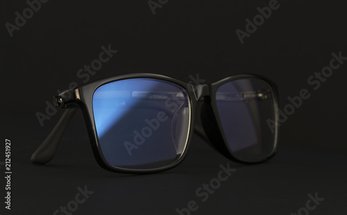 Anti blue light computer glasses on the black background.