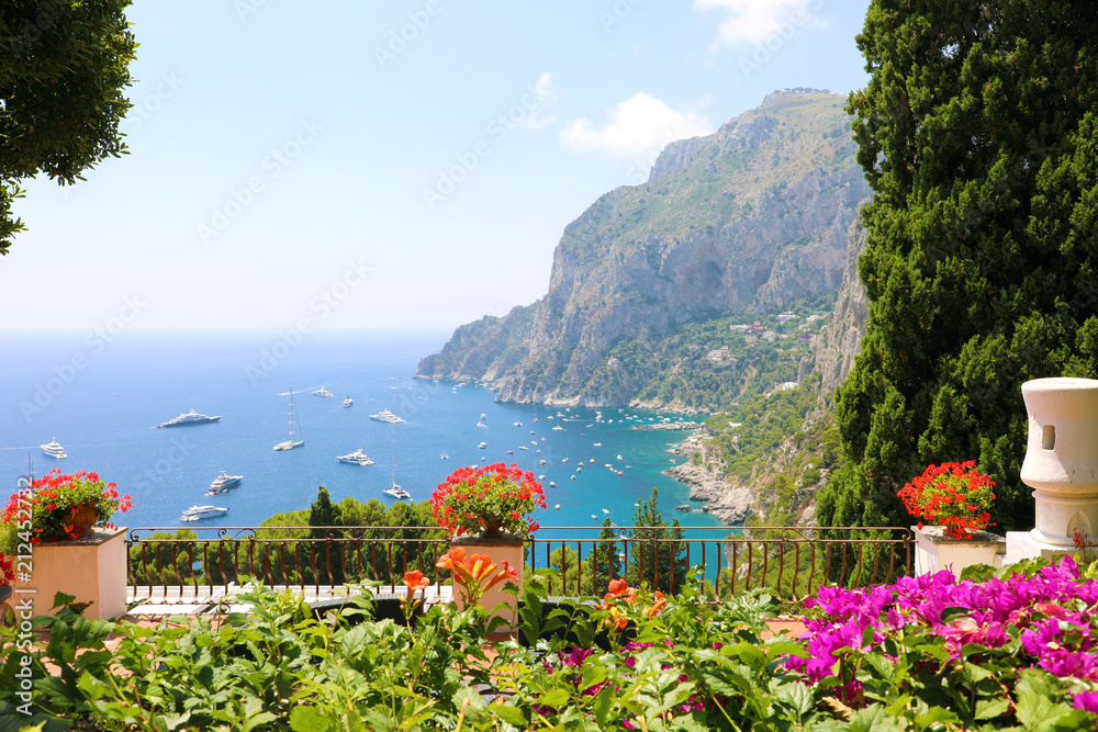 Panoramic view from flower garden terrace on Capri bay, Italy