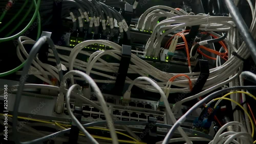Working Ethernet switch in a dark data center room. Many flashing green lamps Working Ethernet switch in a dark data center room. Many flashing green lamps