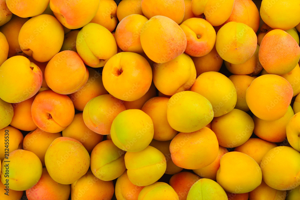 Ripe juicy orange apricots fruit background. Ripe juicy orange apricots fruit background.