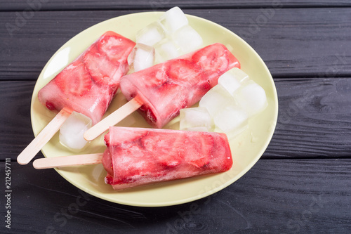 Homemade popsicles with strawberry