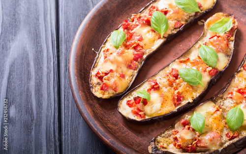 Eggplant with tomatoes , cheese and basil