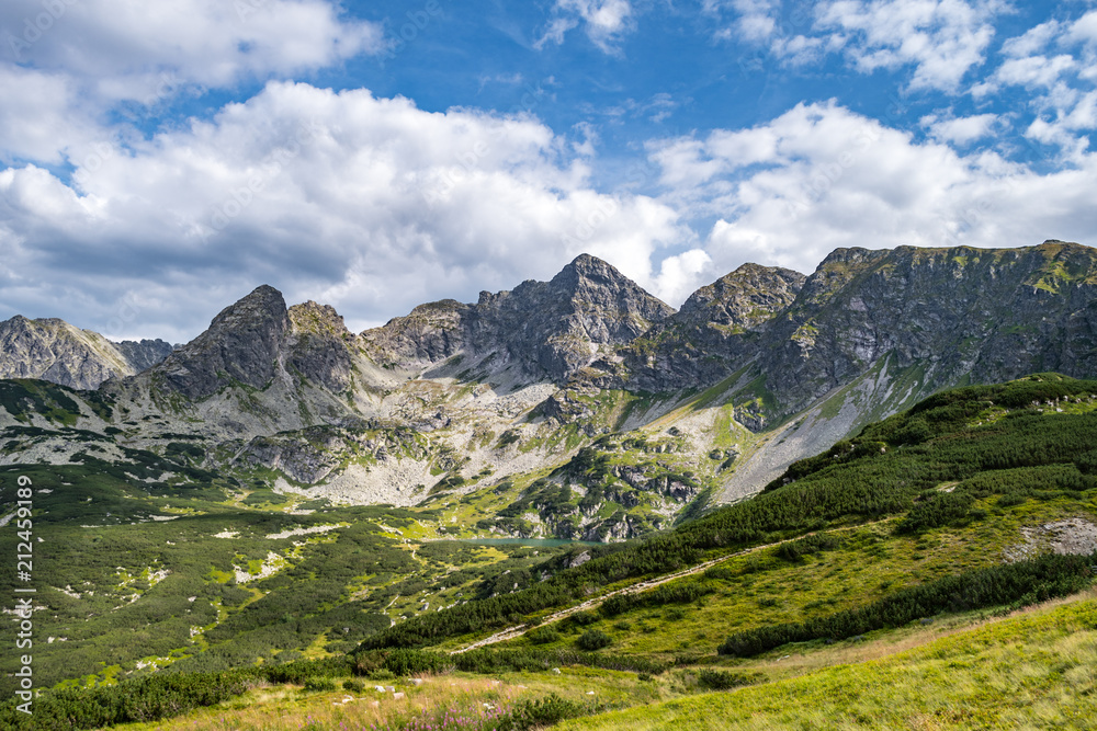 Mountain peaks and ridges in the Tatra Mountains. Tarns seen in the valley.