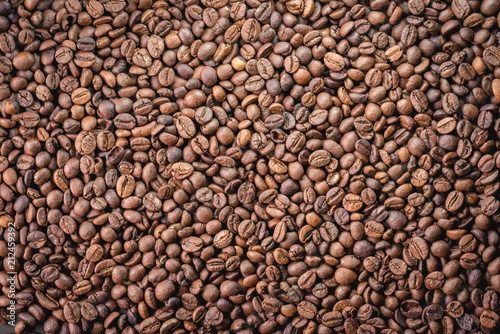 Close up of coffee beans are the background.