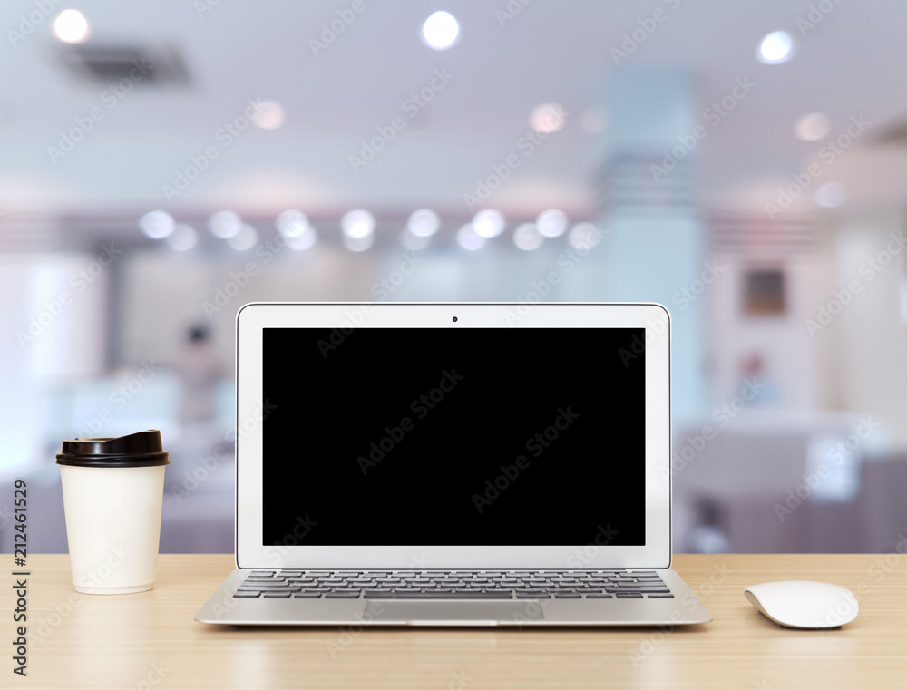 blank screen Laptop Computer on wooden desk and office blurry background blank screen Laptop Computer on wooden desk and office blurry background