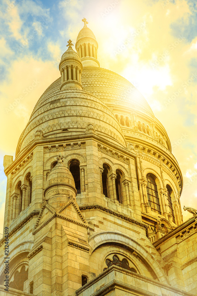 Detail of Dome of Sacred Heart of Paris church in France. Basilique du Sacre-Coeur de Montmartre, the historic district of Paris Capital. Sunset light. Vertical shot.