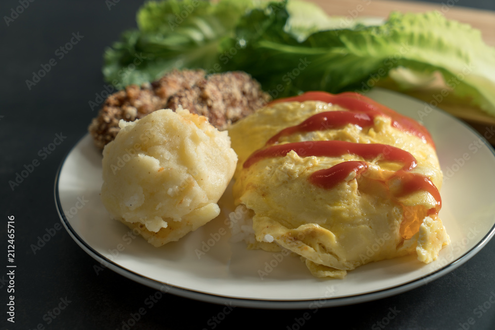 Egg-covered rice with textured background