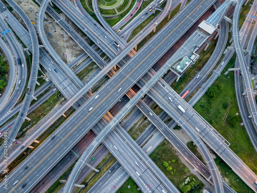 Top view of Highway road junctions. The Intersecting freeway road overpass the eastern outer ring road of Bangkok, Thailand.