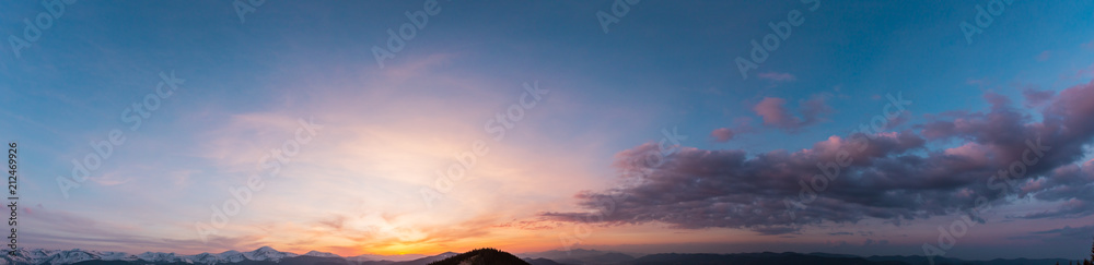 Sunset sky above mountains