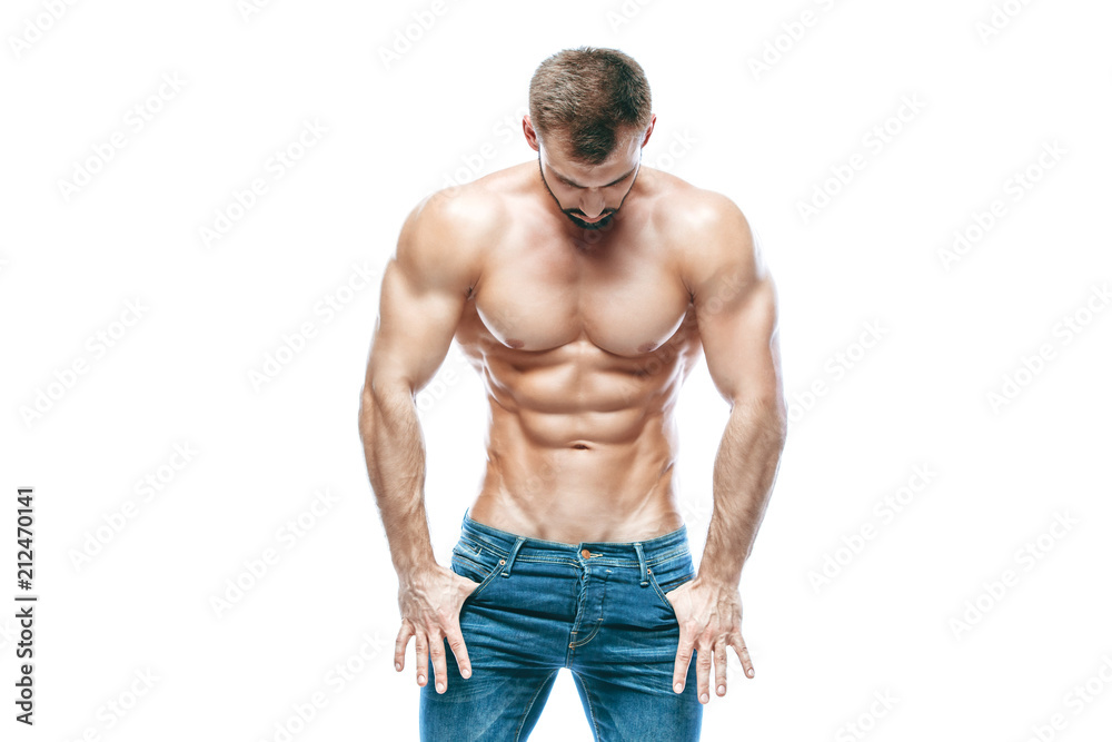bodybuilder posing. Beautiful sporty guy male power. Fitness muscled in blue jeans. on isolated white background. bodybuilder posing. Beautiful sporty guy male power. Fitness muscled in blue jeans. on isolated white background.