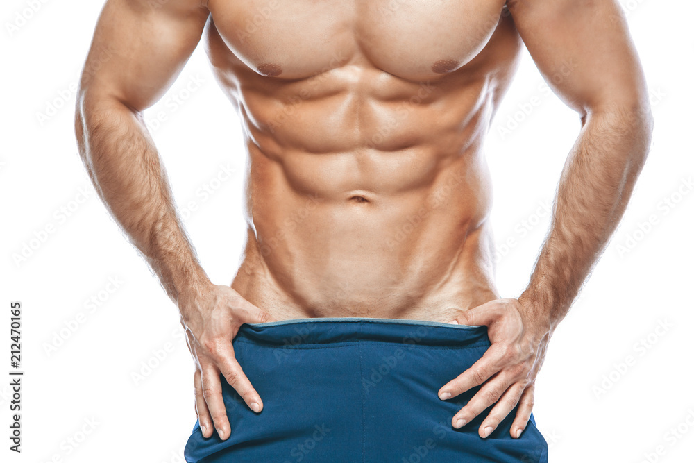 Muscular man showing six pack abs isolated on white background