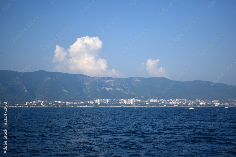 Gelendzhik, Russia - June 27, 2018: The view of the town and Markotkh ridge from the sea Gelendzhik, Russia - June 27, 2018: The view of the town and Markotkh ridge from the sea