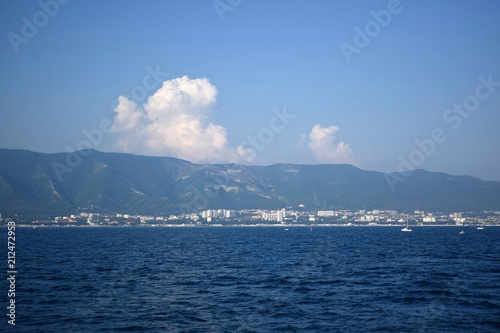 Gelendzhik, Russia - June 27, 2018: The view of the town and Markotkh ridge from the sea photo