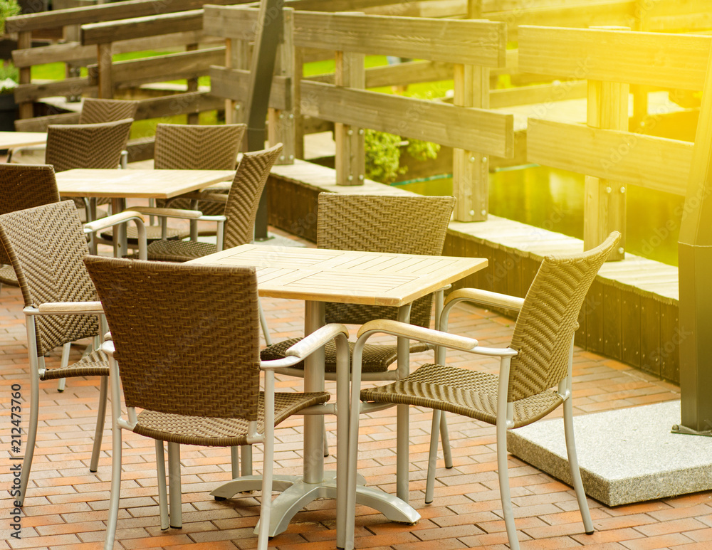 Cafe entrance tables tables outside sun 