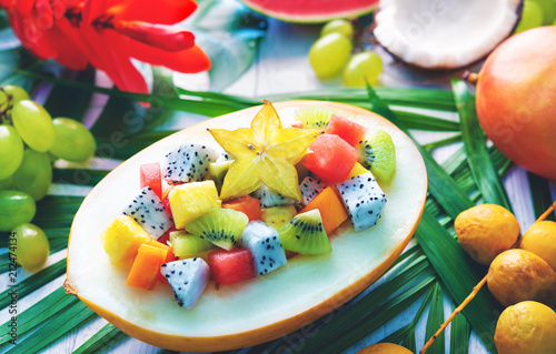 Fototapeta Naklejka Na Ścianę i Meble -  Exotic tropical fruits salad served in half a melon