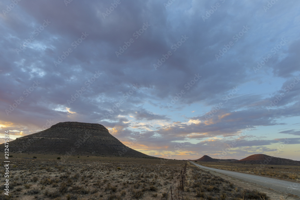 Gravel road and kopjes in the Karoo