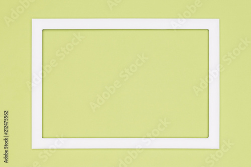 Abstract flat lay pastel green colored paper texture minimalism background. Minimal template with empty picture frame mock up.