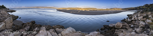 The sunset is coming and the last rays from the sun iluminate the horizon at  Salinas de Pullally   Chile  an amazing place with really nice wetlands with the exit of the river to the sea just amazing