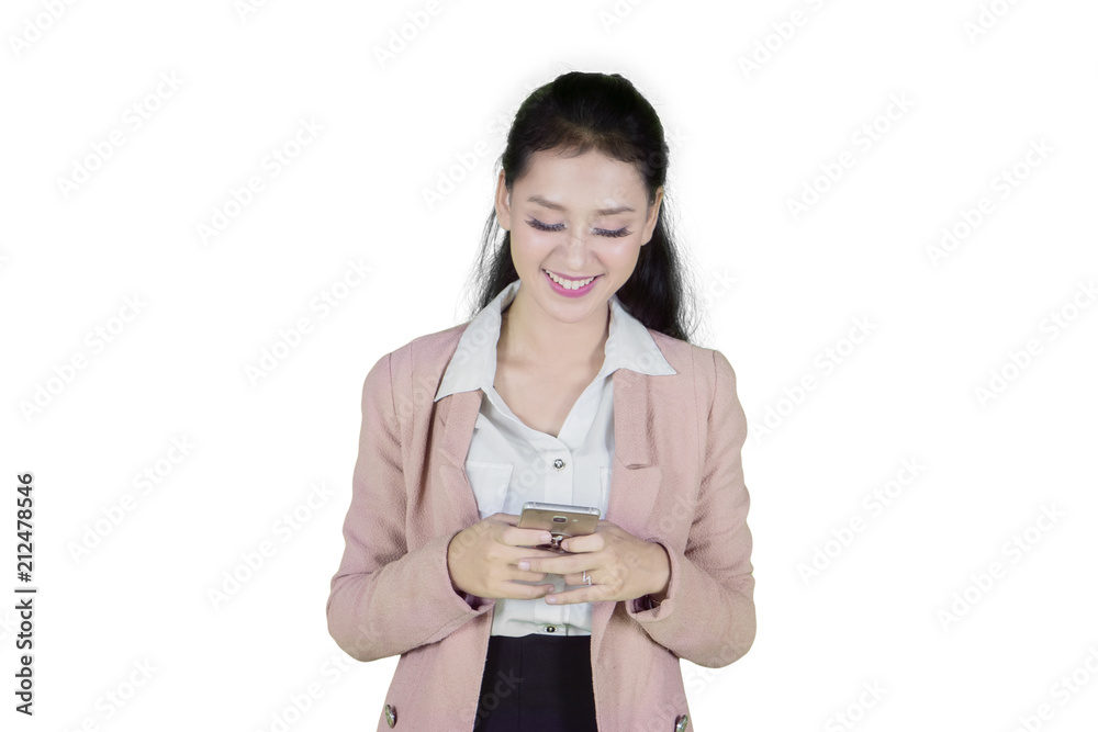Caucasian entrepreneur using a phone on studio Caucasian entrepreneur using a phone on studio