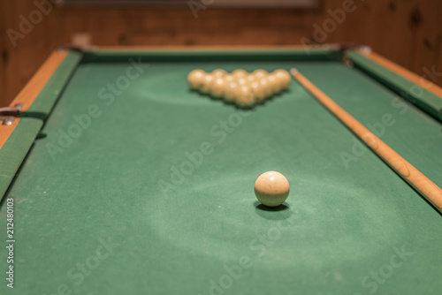 Wallpaper Mural billiard table with balls and cue stick. gambling table with russian billiard set and cue Torontodigital.ca