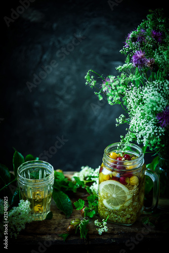 Gooseberry and eldeflower  vodka..style vintage. selective focus photo