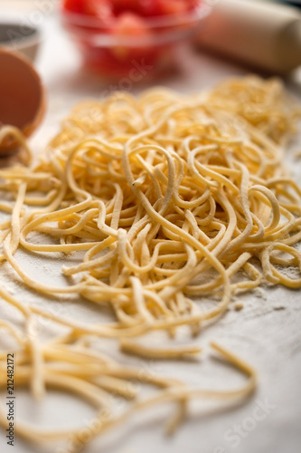 Dried egg noodles. Raw Fresh Spaghetti