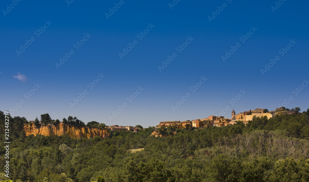 View of Roussillon with ocher cliffs. Vaucluse, Provence, France