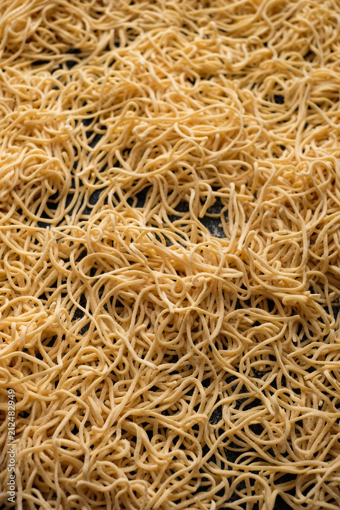 Dried egg noodles. Raw Fresh Spaghetti. Food background Dried egg noodles. Raw Fresh Spaghetti. Food background