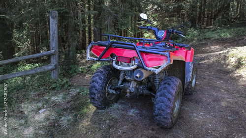 red quad bike in the forest, close-up