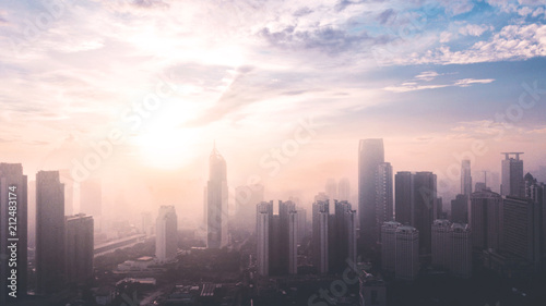 Jakarta cityscape with air pollution at sunrise time