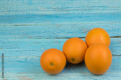 Ripe orange fresh orange, on wooden background photo