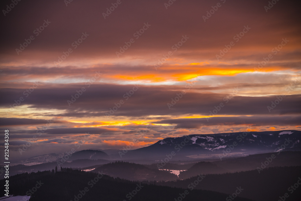 Fantastic colors of clouds at the sunset in Carpathians Mountains