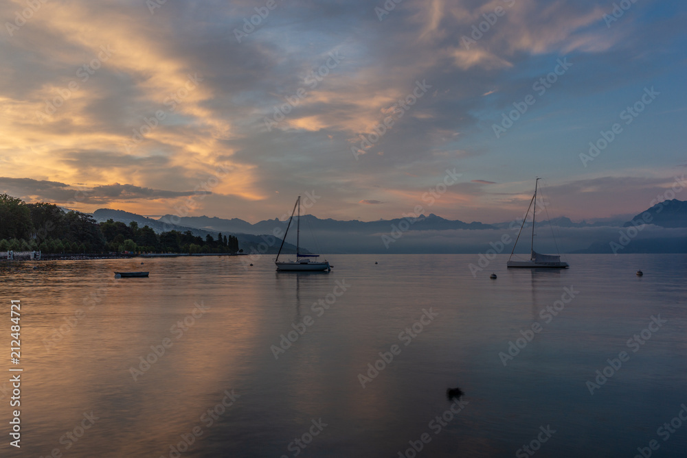 Colorful sunrise on the marina of Lausanne on the Lake Leman in summer with the view of the Swiss Alps in background - 19
