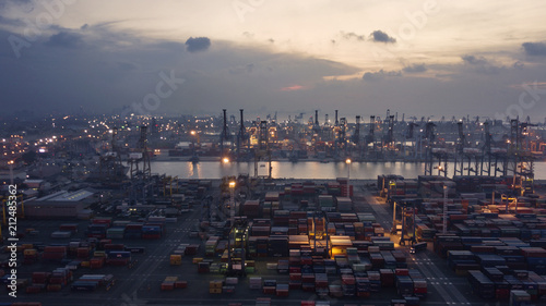 Tanjung Priok port with silhouette of containers photo