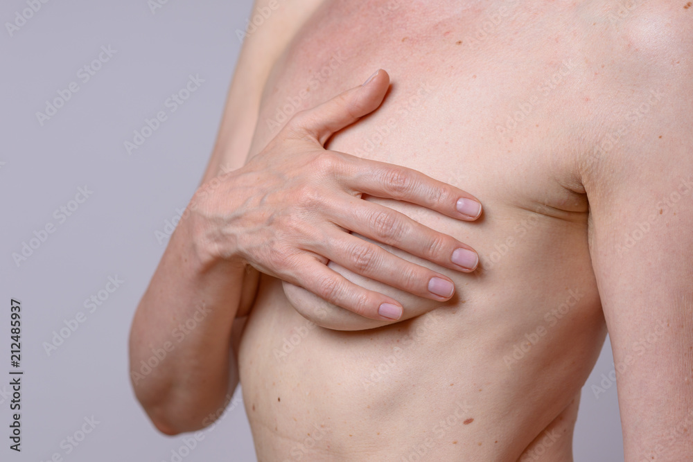 Woman is examining her breast Woman is examining her breast