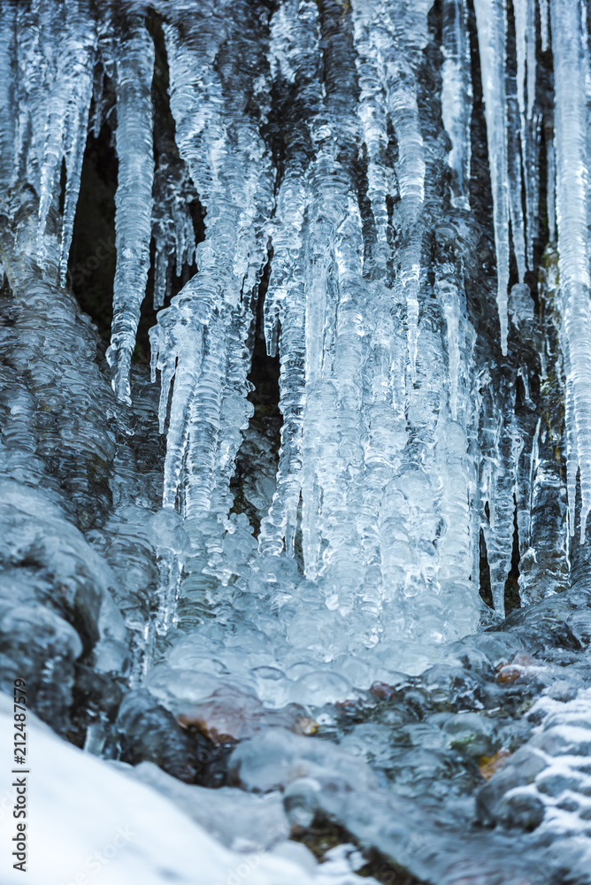 Fototapeta premium Icicles on the stones ion cold winter
