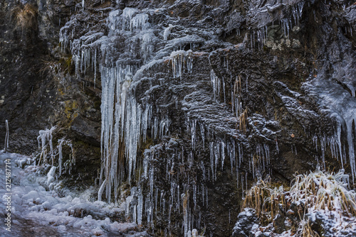 Icicles on the stones ion cold winter