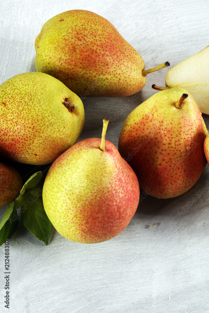 Fresh ripe organic pears on rustic wooden table, natural background, vega, diet food. Fresh ripe organic pears on rustic wooden table, natural background, vega, diet food.