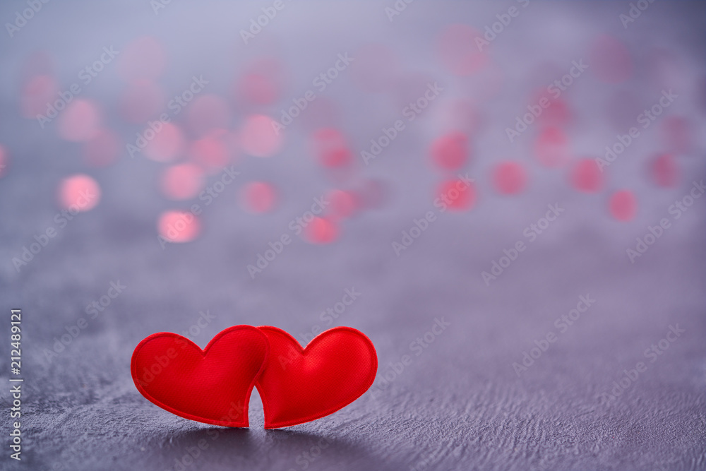 Two red loving hearts touch each other.Couple red hearts as a symbol of love Two red loving hearts touch each other.Couple red hearts as a symbol of love