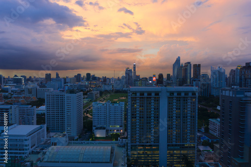 Storm clouds with rain passing over sky of Bangkok cityscape. 4K Timelapse