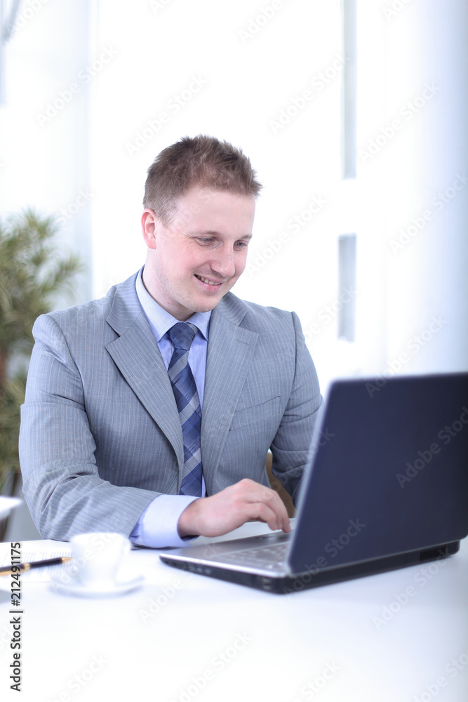 Handsome businessman is working in a office Handsome businessman is working in a office