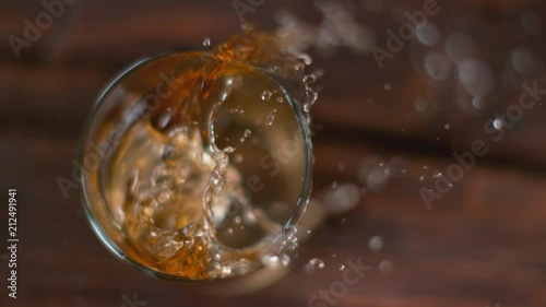 Wallpaper Mural Ice dropped into glass of whisky in super slow motion. Shot with high speed cinema camera, 1000fps. Torontodigital.ca
