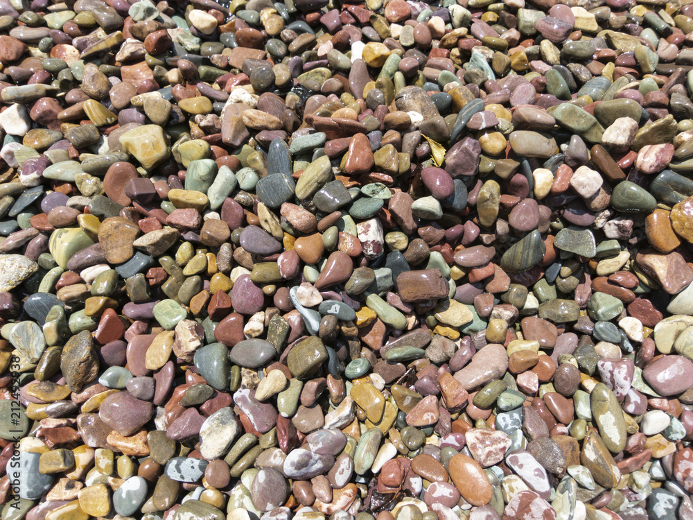 Smooth polished stones on a lake's shoreline Smooth polished stones on a lake's shoreline