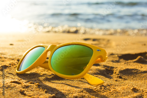 Sunglasses on the tropical beach. Travel relax vacation - azure sea, white sand, shining sun, Summer paradise day on exotic bay