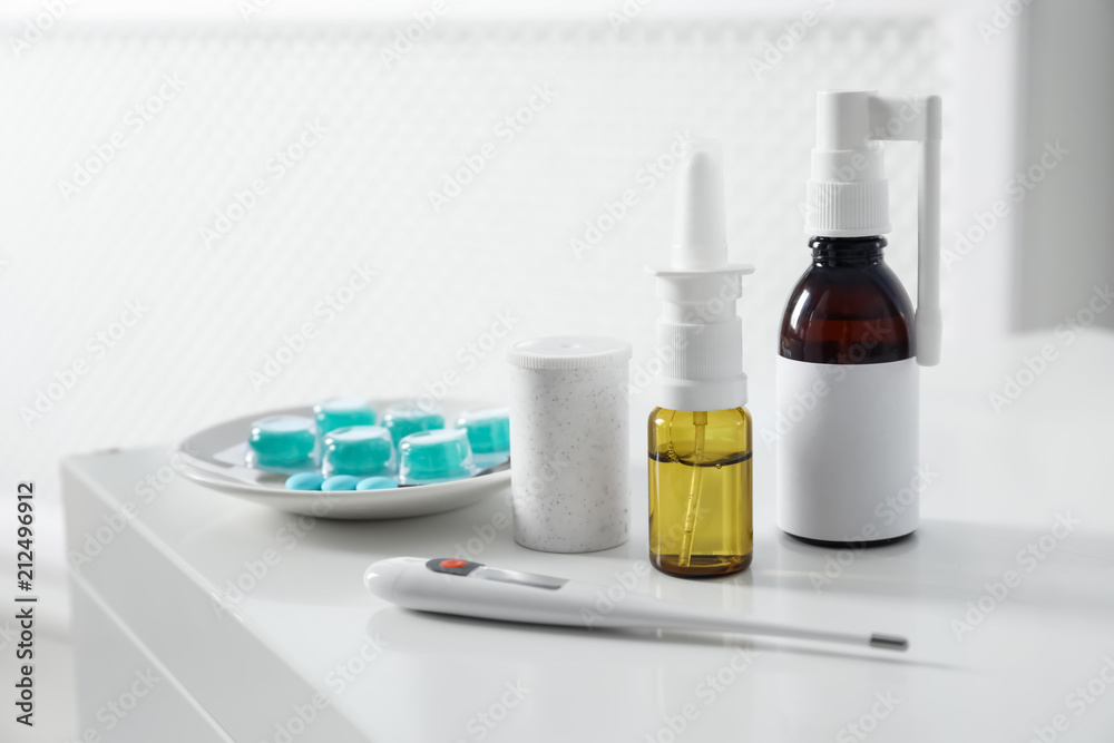 Set of different cold remedies on table indoors Set of different cold remedies on table indoors