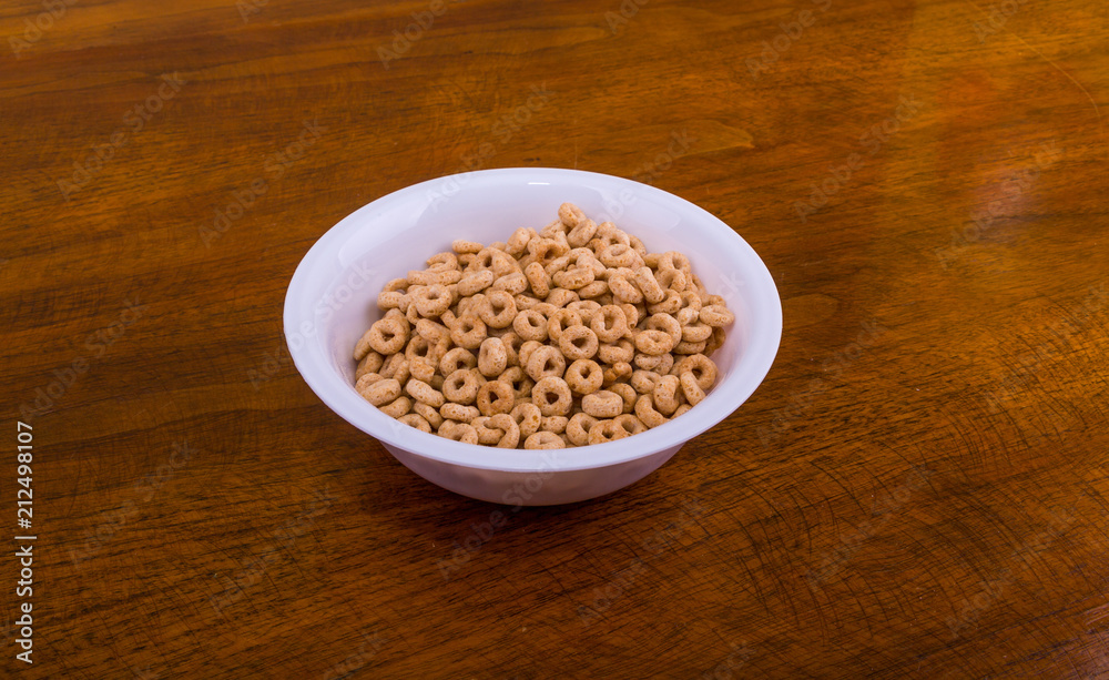 Toasted Oat Cereal in White Bowl Toasted Oat Cereal in White Bowl