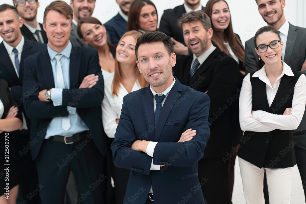 leader standing in front of a large business team leader standing in front of a large business team