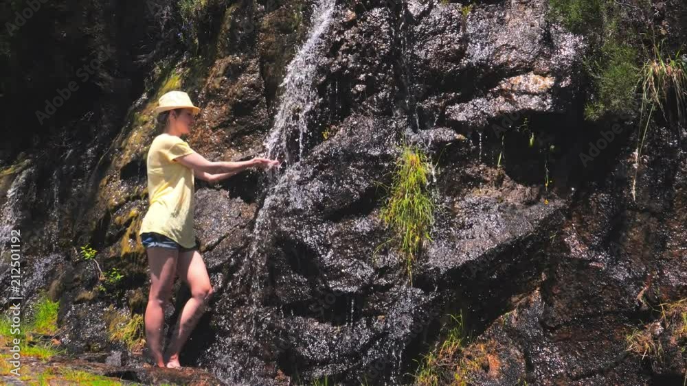 Beautiful young traveling woman enjoy the waterfall. Beautiful young traveling woman enjoy the waterfall.