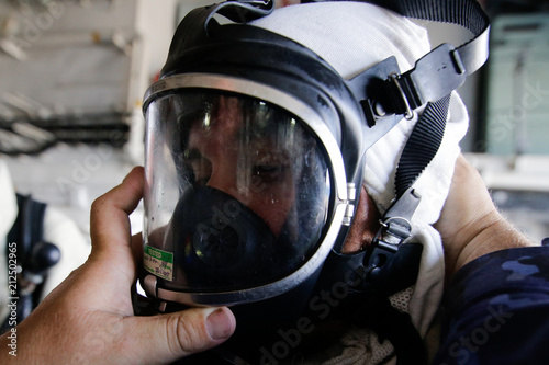 omanian special forces marine using a firefighter mask photo