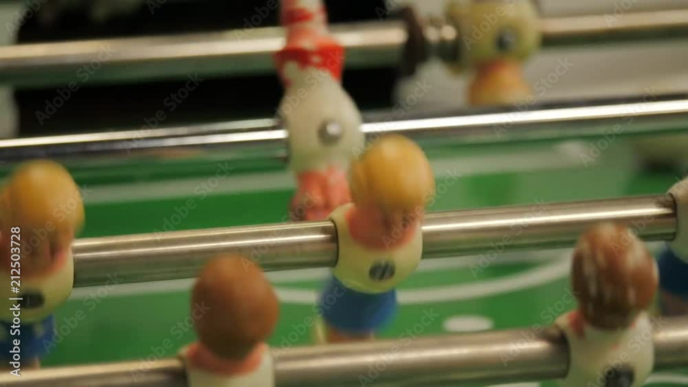 Close of warn out foosball players Close of warn out foosball players